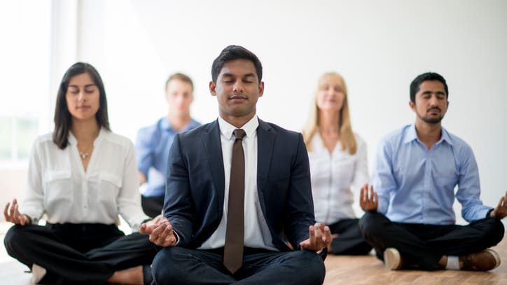 Corporate meditation and healing session for employees